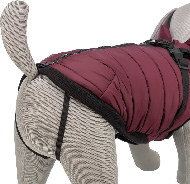 Hundtäcke i polyester och bomull med teddyplysch och stoppning (200 g/m²), genomgående dragkedja på ryggen, elastiskt inlägg i magpartiet och justerbara öglor för bakbenen.